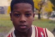 A young Dwyane Wade carries a basketball like a shield for Gatorade