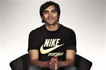 AKQA founder Ajaz Ahmed, wearing a black t-shirt with the words 'Nike Sportswear' printed in yellow