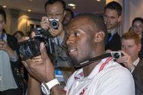 Usain Bolt gets to grips with Samsung's NX300 smart camera