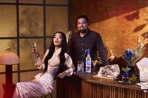 Musician Rina Sawayama holds a Grey Goose martini while seated next to chef Luke Selby 