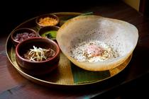 An egg hopper and lamb kari dish by Soho restaurant, Hoppers (John Candy)