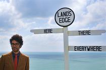 Integrated Marketing Agency of the Year: Wunderman Thompson (image of man by comedy 'Land's Edge' sign