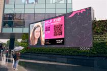 Billboard with the words "help find Leah Croucher" alongside an image and a QR code