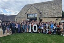 Performance Marketing Agency of the Year: Croud (image of employees outside a barn with giant number 10