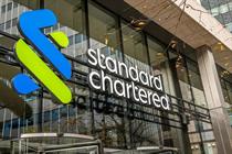 Front view of Standard Chartered office building with enormous 'Standard Chartered' logo and name