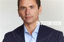 Head ands shoulders shot of Ian Whitaker looking neutrally into the camera with the words 'Investor view' overlaid in white to the right of him