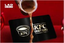Gravy dripping over a black KFC gravy card 