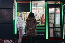 Two women stand outside shawarma restaurant in Kyiv, Ukraine
