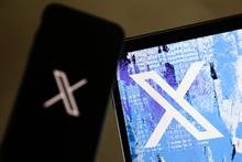The X logo on a computer and phone screen
