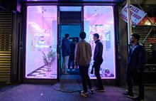 People walking into Neon’s NFT ATM store