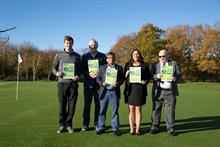 Authors of the World BioProtection Forum paper on a golf course holding the report