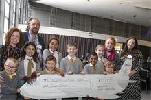 Staff and pupils from Cheadle Catholic Infant & Junior School celebrate their grant