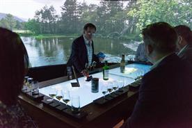 A brand ambassador guides guests through the digital, interactive table