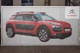 The mosaic comprises almost 3,000 toy model cars