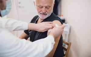 older person getting a vaccine