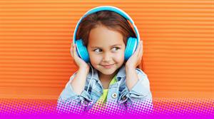A photograph of a small child wearing headphones