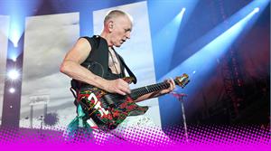 Def Leppard guitarist Phil Collen performing on stage