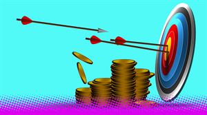 Financial achievement concept with a target and arrows in the center next to stacks of gold coins - stock photo