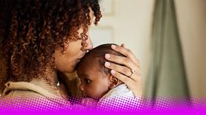 Mother kissing with her baby boy in her arms - stock photo