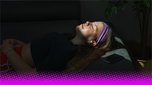 Listening with headphones while sleeping - stock image 