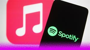 spotify logo with apple music in the background