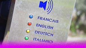 A box with a speakerphone graphic and buttons for French, English, German and Italian