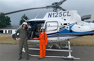 USGS gas geochemists Christoph Kern (left) and Laura Clor (right) during the airborne gas survey of Mount Rainier. Credit: USGS