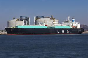 Picture of a large LNG (Liquefied natural gas) tanker ship unloading its cargo at LNG terminal