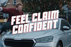 a man slides across the bonnet of his car