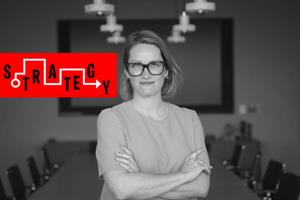 A black and white headshot of AMV's Jo Arden with the word 'strategy' in a red rectangle