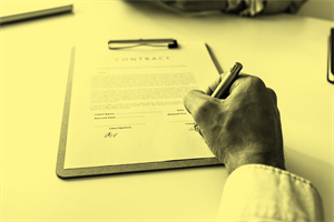 Close up of someone signing a contract