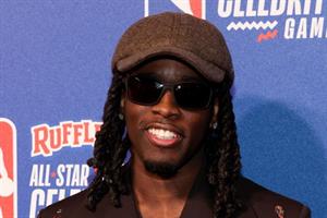 Cenat at the 2024 Ruffles NBA All-Star Celebrity Game. (Photo credit: Kevin Mazur/Getty Images).