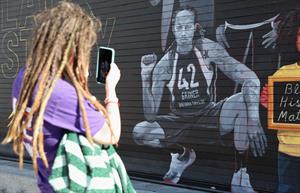 A mural depicting Brittney Griner outside the Footprint Center in Phoenix. (Photo credit: Getty Images).