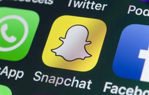 Consumers often share information about their shopping experiences on Snapchat. (Photo credit: Getty Images).