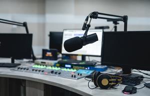 Nearly half of podcasters look at downloads to gauge their reach. (Photo credit: Getty Images).