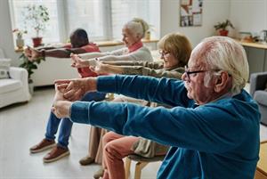 Older people exercising in chairs