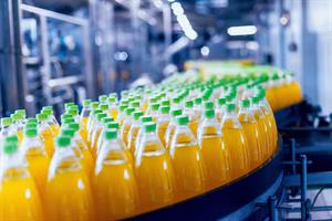 Bottles of fruit juice on a conveyor belt