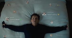 Tom Holland lies in bed surrounded by text messages