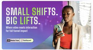 A woman holds a smart phone, the words 