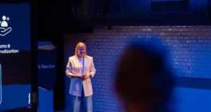 Woman on stage presenting
