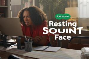 A woman squinting at her computer with text overlaid saying: Specsavers - Resting squint face