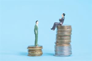 Model figures on coins. (Credit: Aitor Diago via Getty Images)