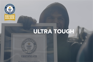 A man holding up a Guinness World Records certificate