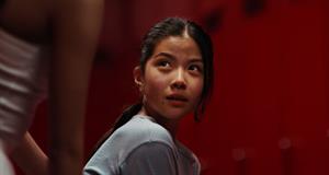A woman looks over her shoulder in the Kotex ad ‘Own Your Flow’