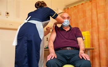 Rollout of second COVID-19 vaccine begins amid move to new dosing strategy
