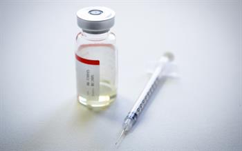 Insulin vial and syringe on a white background
