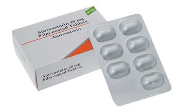 A box and blister pack of atorvastatin tablets.
