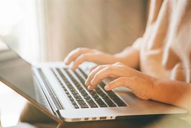 Person typing on a computer