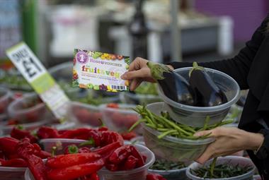 Using voucher to pay for vegetables