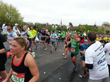 Dr Bingham (wearing a green vest with 'Stu' on) in the London marathon